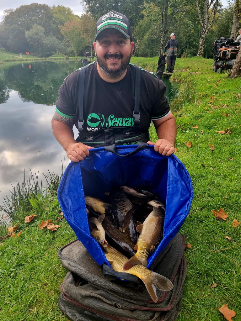 John Harvey with a net of fish after a successful session